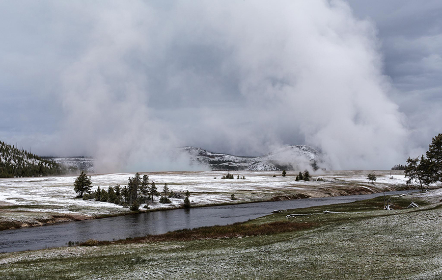 Midway Geyser Basin with mist coming off Grand Prismatic Spring and Excelsior Geyser
