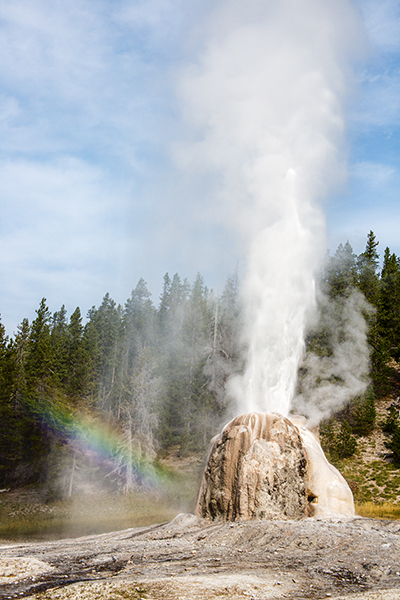 Lonestar Geyser in eruption with a rainbow.
