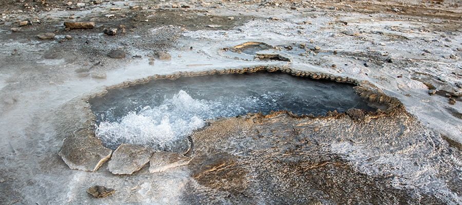 Ear Spring with geyserite edge breaking up.